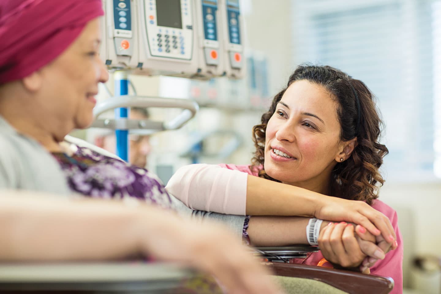 A trio of nurses looking at a tube