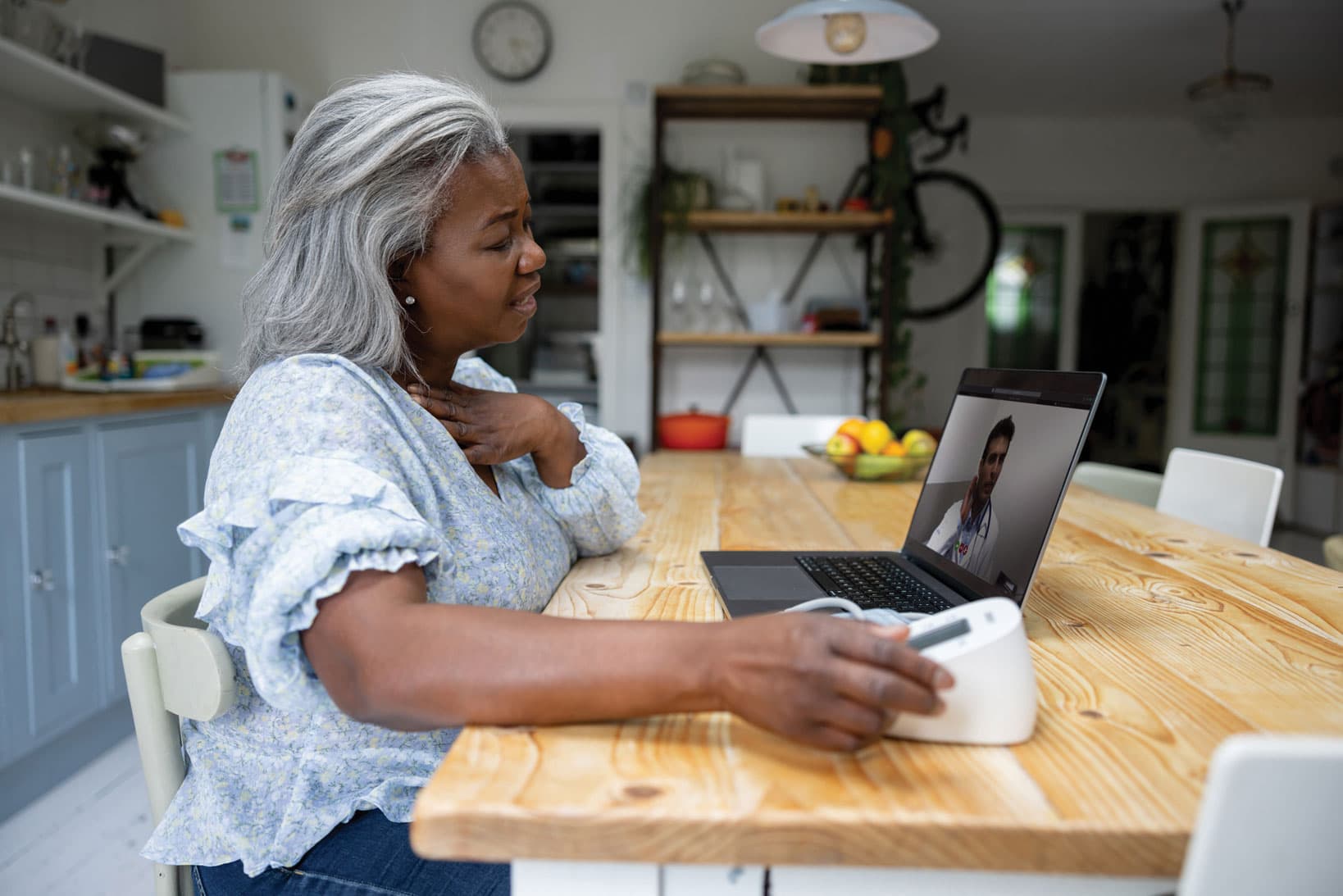 A patient receiving virtual care at her home